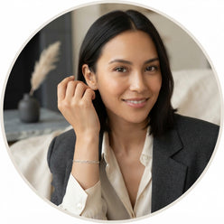 Maya James, a minimalist influencer, wearing a polished 925 sterling silver Figaro link chain in a professional portrait.